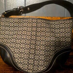 Authentic black and tan coach m0782-f10923 handbag/purse with silver buckle